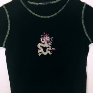 Woman’s dragon top.